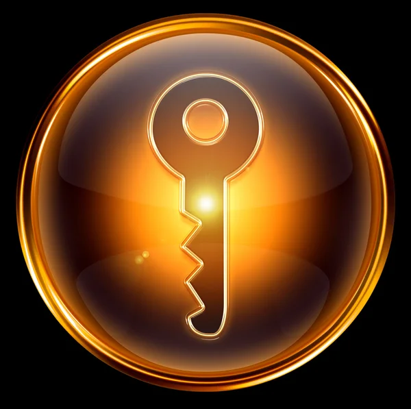 Золота значка ключа, ізольована на чорному тлі — стокове фото