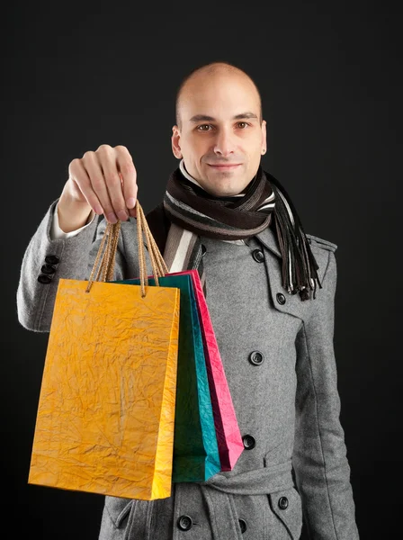 Young man with shopping bags — Stock Photo, Image