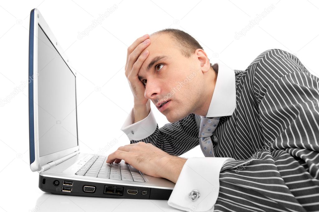 Worried businessman with computer