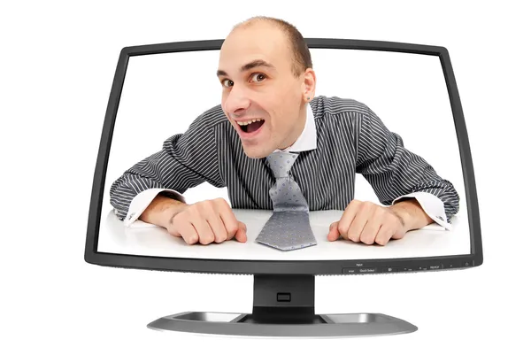 Homem engraçado olha para fora do monitor — Fotografia de Stock