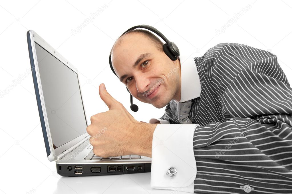 Friendly telephone operator with laptop showing thumb up