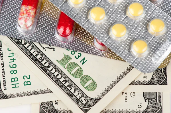 Pills and money — Stock Photo, Image