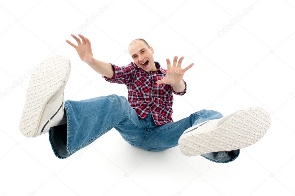 Falling young man isolated on white background