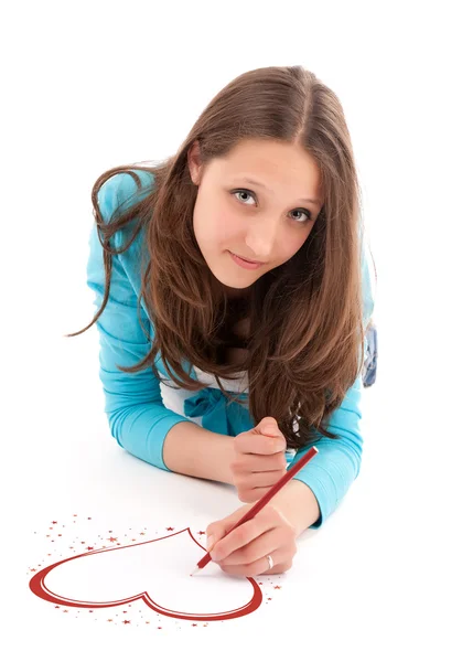 Mladá žena kreslí tužkou na bílou podlahu — Stock fotografie