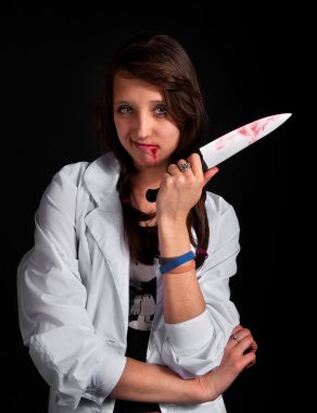 Angry nurse with bloody knife over black clipart