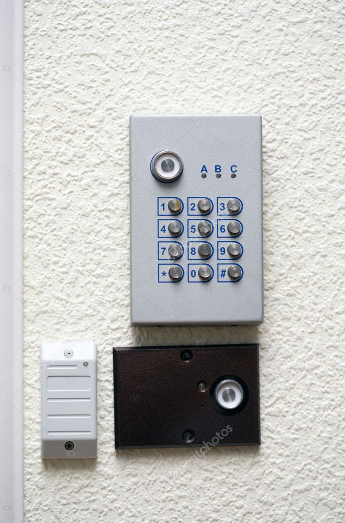 A security pad and voice intercom system on the wall