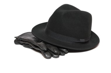 Felt hat and pair of leather gloves on white background clipart