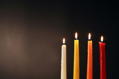 Lighting Candles On Dark clipart