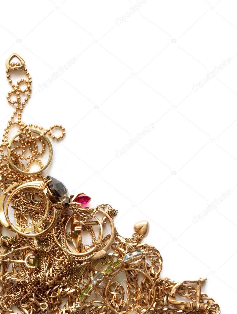 Pile of gold jewelry isolated on white background