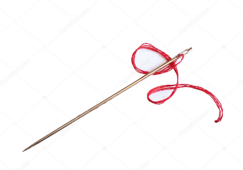 Closeup of needle with red thread on white background