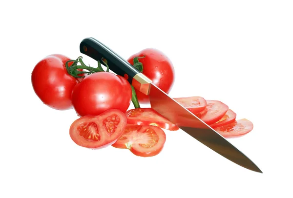 Geschnittene Tomaten und Messer — Stockfoto