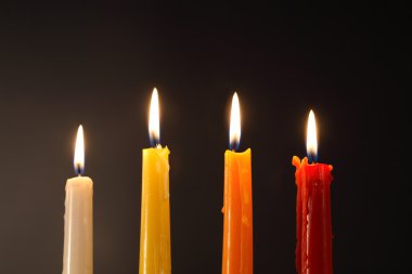 Lighting Candles On Dark clipart