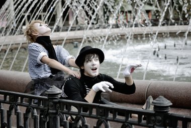 Two mimes at fountain. pantomime clipart