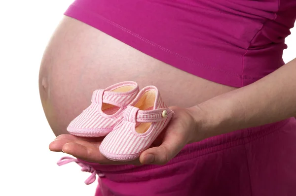 Perfil Mujer Embarazada Con Pequeños Zapatos Las Manos Sobre Fondo —  Fotos de Stock