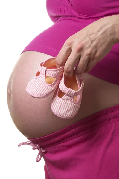 Gravid Kvinna Profil Med Små Skor Händerna Över Vit Bakgrund — Stockfoto