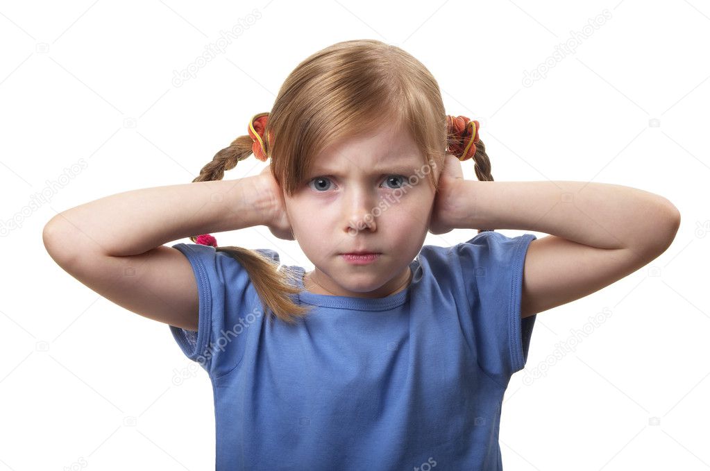 Little girl with both ears closed by hands isolated over white background