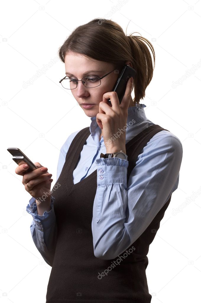 Young adult woman on call with two cell phones portrait
