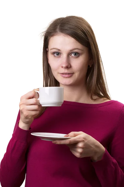 stock image Young woman with white cup and saucer in the hands isolated over white background