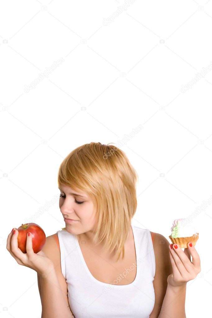 Young woman with cake and apple