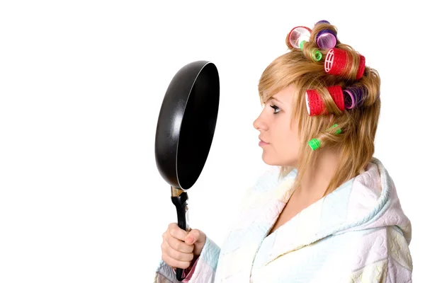 Housewife with curlers and pan — Stock Photo, Image