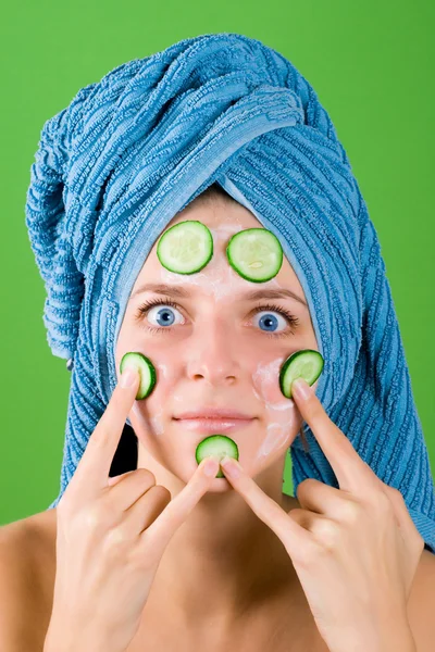 Woman in blue towel and mask from cucumber — Stock Photo, Image