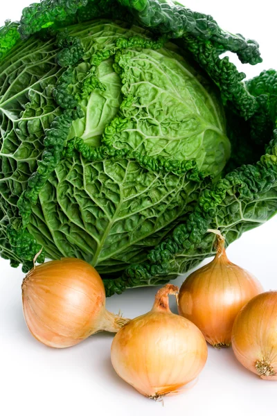 Fresh savoy cabbage and onions — Stock Photo, Image