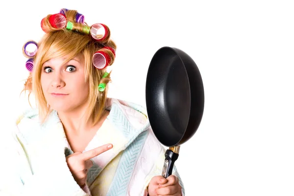 Funny housewife with curlers and pan — Stock Photo, Image