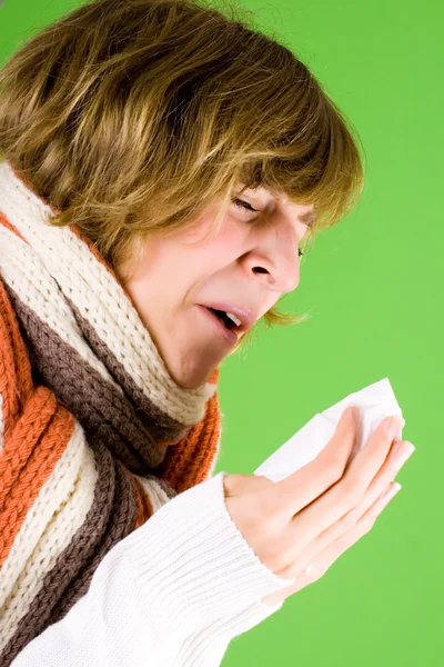 Portrait of a cold girl sneezes — Stock Photo, Image