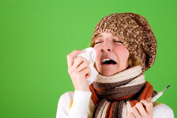 Cold girl sneezes — Stock Photo, Image