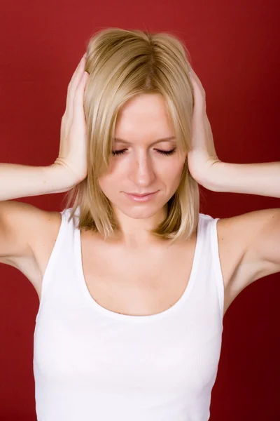 Woman covering her ears — Stock Photo, Image