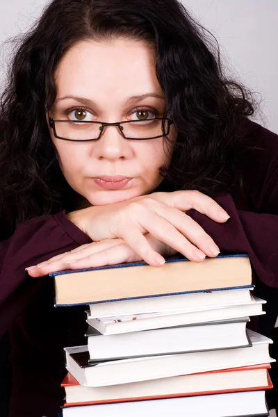 Attractive woman with stack of books — Stock Photo, Image