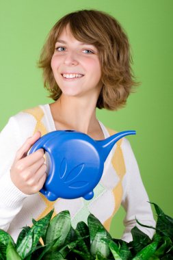 Girl watering flowers clipart