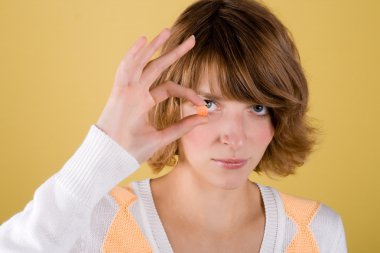 Young woman with pill clipart