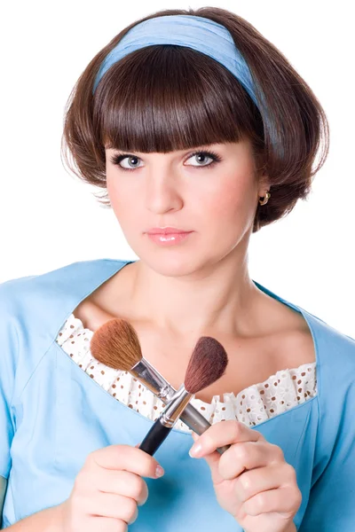 Woman in blue dress with two make-up brushes — Stock Photo, Image