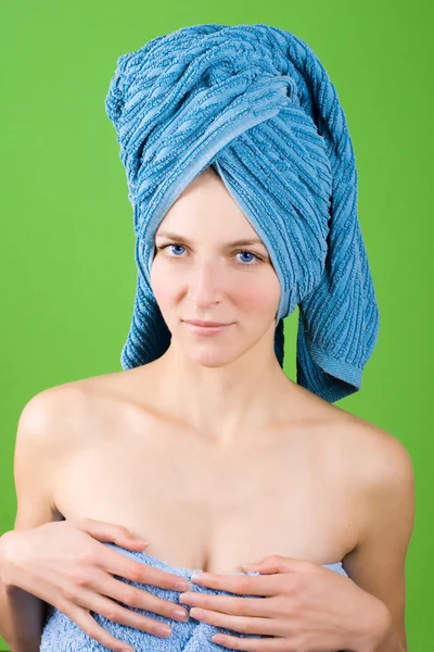 Young woman in blue towel — Stock Photo, Image