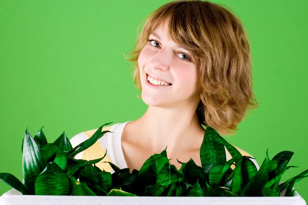 Happy girl with plants — Stock Photo, Image