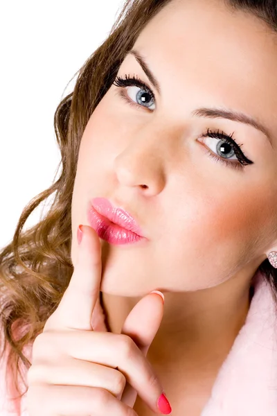 Młoda kobieta z palcem na ustach — Zdjęcie stockowe