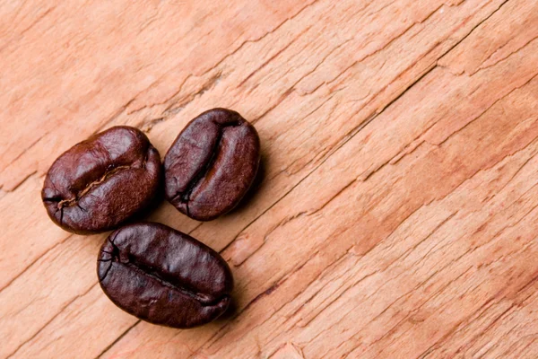 Three fried coffee beans — Stock Photo, Image
