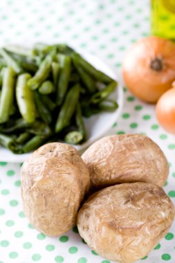 Baked potatoes and french beans clipart