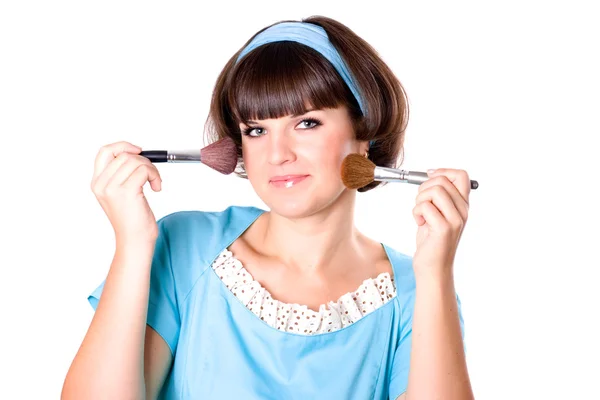 Brunette woman with two make-up brushes — Stock Photo, Image