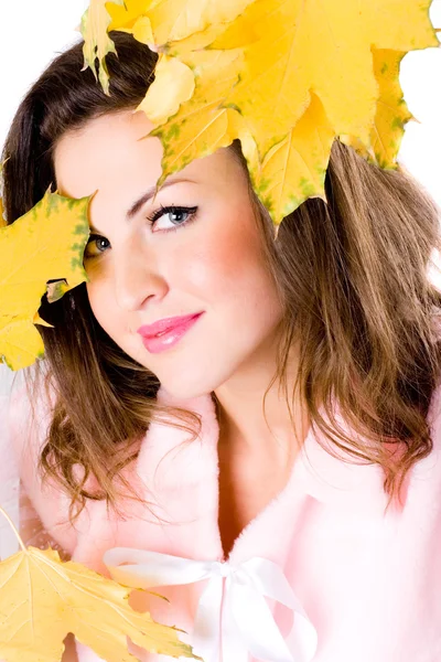 Beautiful young woman with yellow leaves — Stock Photo, Image
