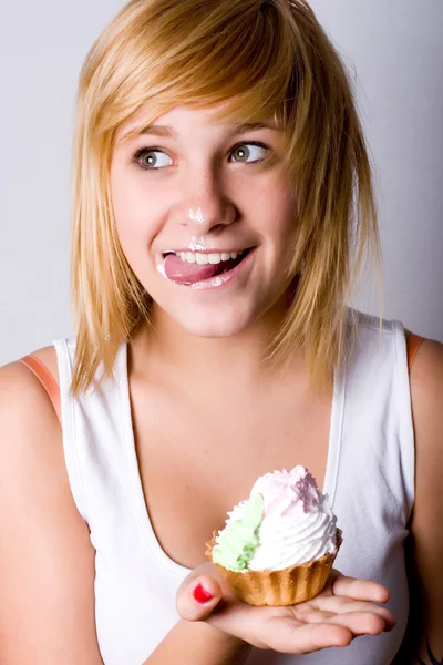 Funny young woman with cake — Stock Photo, Image