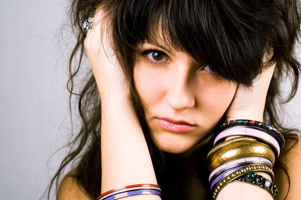 Young brunette lady with bracelets — Stock Photo, Image