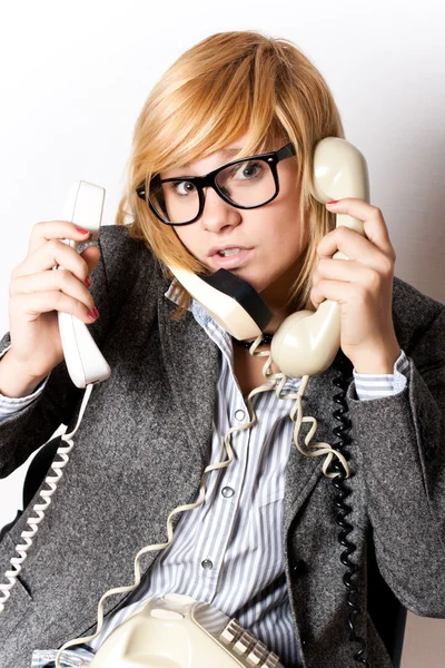 Businesswoman with three phones — Stock Photo, Image