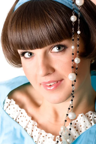 Woman in blue dress with pearl beads — Stock Photo, Image