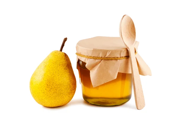 Honey in glass jar, pear, wooden spoon isolated on white backgro — Stock Photo, Image
