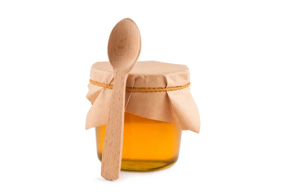 Honey in jar, spoon, isolated white. — Stock Photo, Image