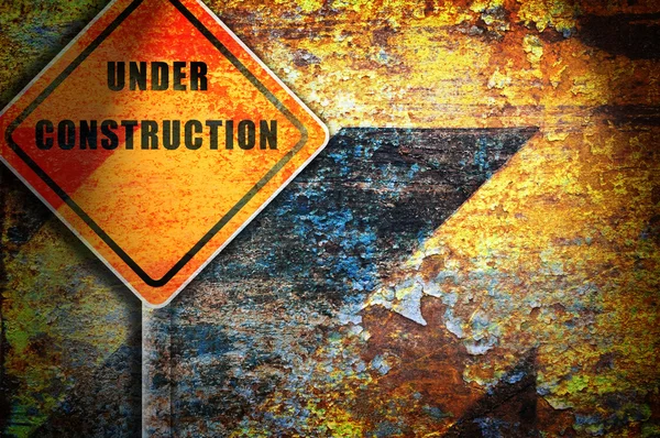 Roadsign under construction rusty wall. — Stock Photo, Image