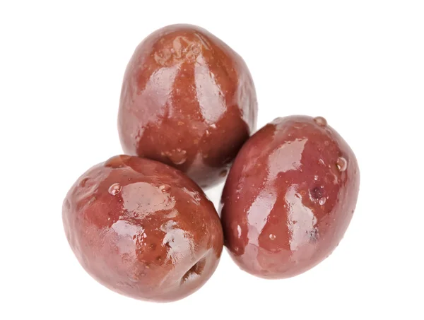 三个棕色腌制的橄榄果实被隔绝在白色 — 图库照片