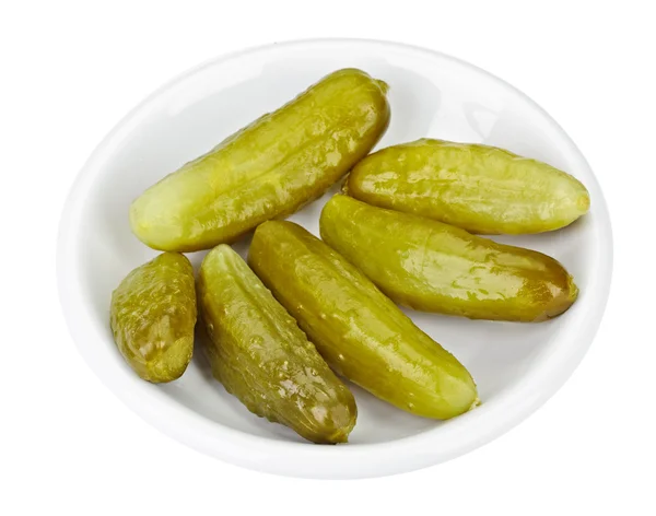 Some pickled cucumbers in white plate isolated — Stock Photo, Image